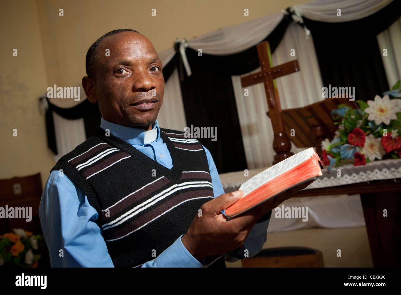 A priest stands at the altar of a church in Morogoro, Tanzania, East Africa. Stock Photo