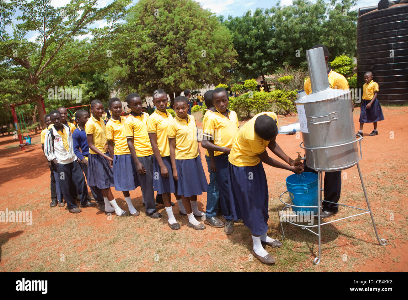 Students queue to wash their hands at a school in Morogoro, Tanzania, East Africa. Stock Photo