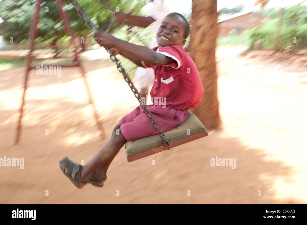 Children play on a playground in Morogoro, Tanzania, East Africa. Stock Photo