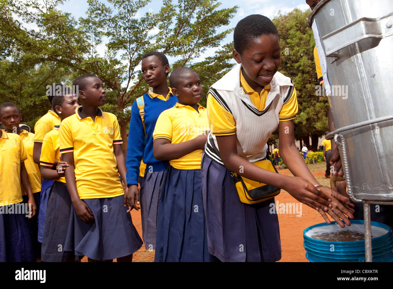 Students queue to wash their hands at a school in Morogoro, Tanzania, East Africa. Stock Photo
