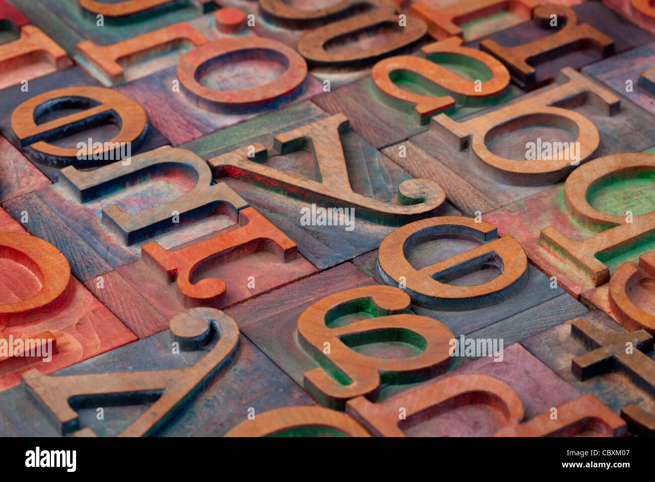 abstract of vintage wooden letterpress printing blocks stained by color