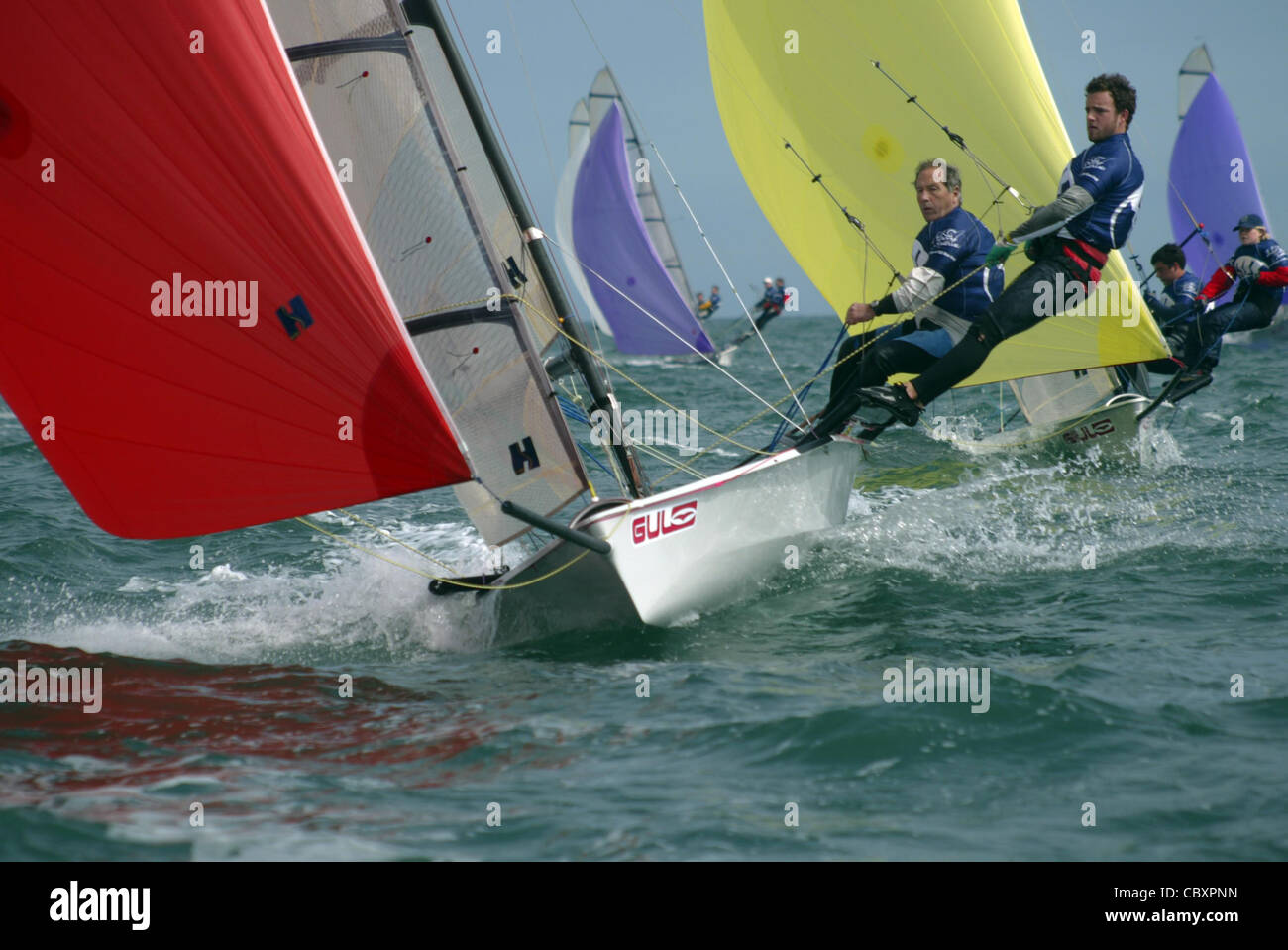 A crew sails their RS 500 ahead of the fleet during a national class event off Hayling Island England Stock Photo