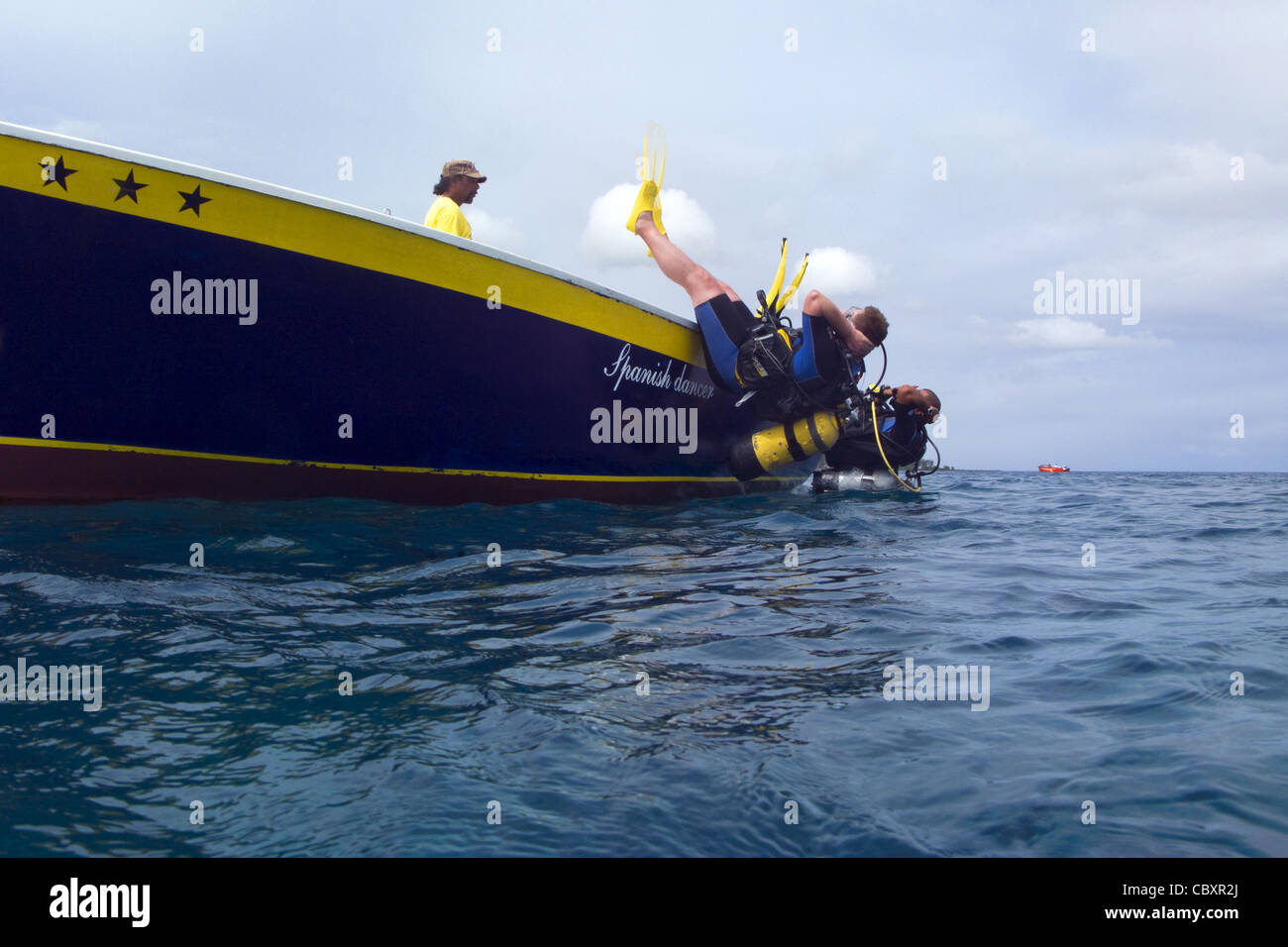 Divers jumping into water from a boat Stock Photo Alamy