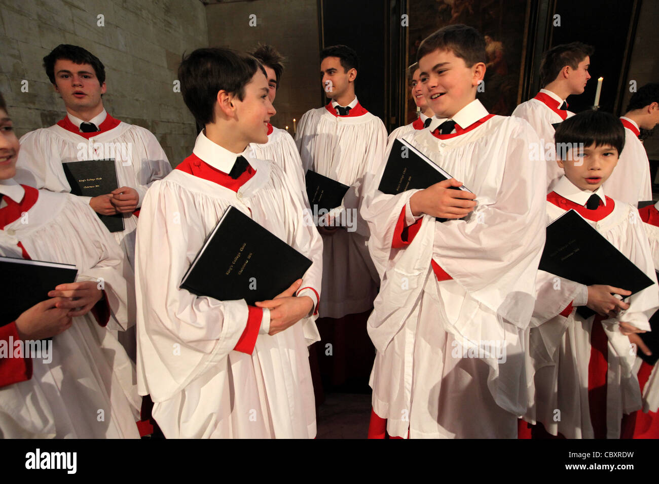KING'S COLLEGE CHOIR BOYS PREPARING FOR THE CHRISTMAS EVE SERVICE AT