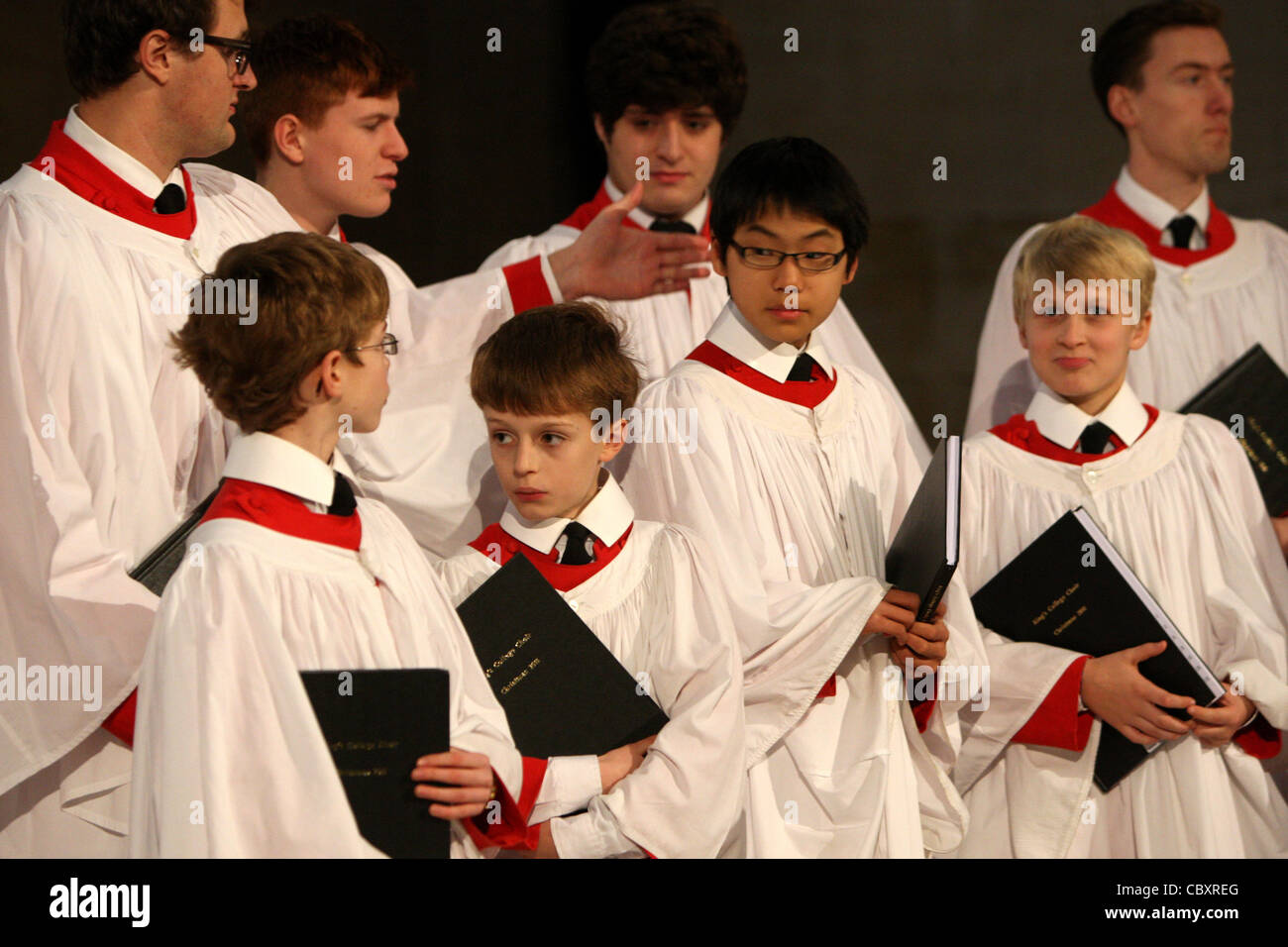 KING'S COLLEGE CHOIR BOYS PREPARING FOR THE CHRISTMAS EVE SERVICE AT