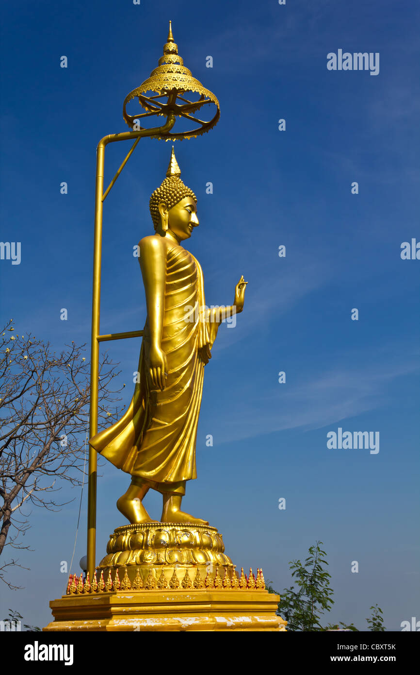 Golden buddha image with blue sky in Thailand Stock Photo - Alamy