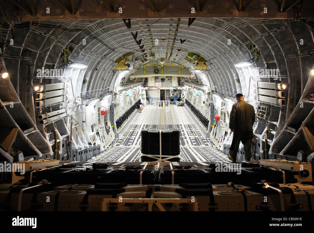 Master Sgt. Michael Lang inspects the cargo area of the newest C-17 Globemaster III delivered to Charleston Air Force Base, S.C., Oct. 28, 2009. Accompanied by an all-Reserve crew, Lt. Gen. Charles Stenner Jr., commander of Air Force Reserve Command, flew the aircraft to Charleston. Stock Photo