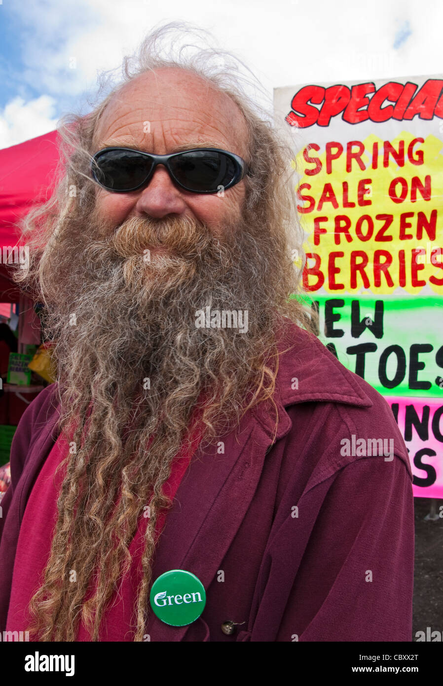 Member of New Zealand's Green political Party at Dunedin Farmers Market next to train station Stock Photo