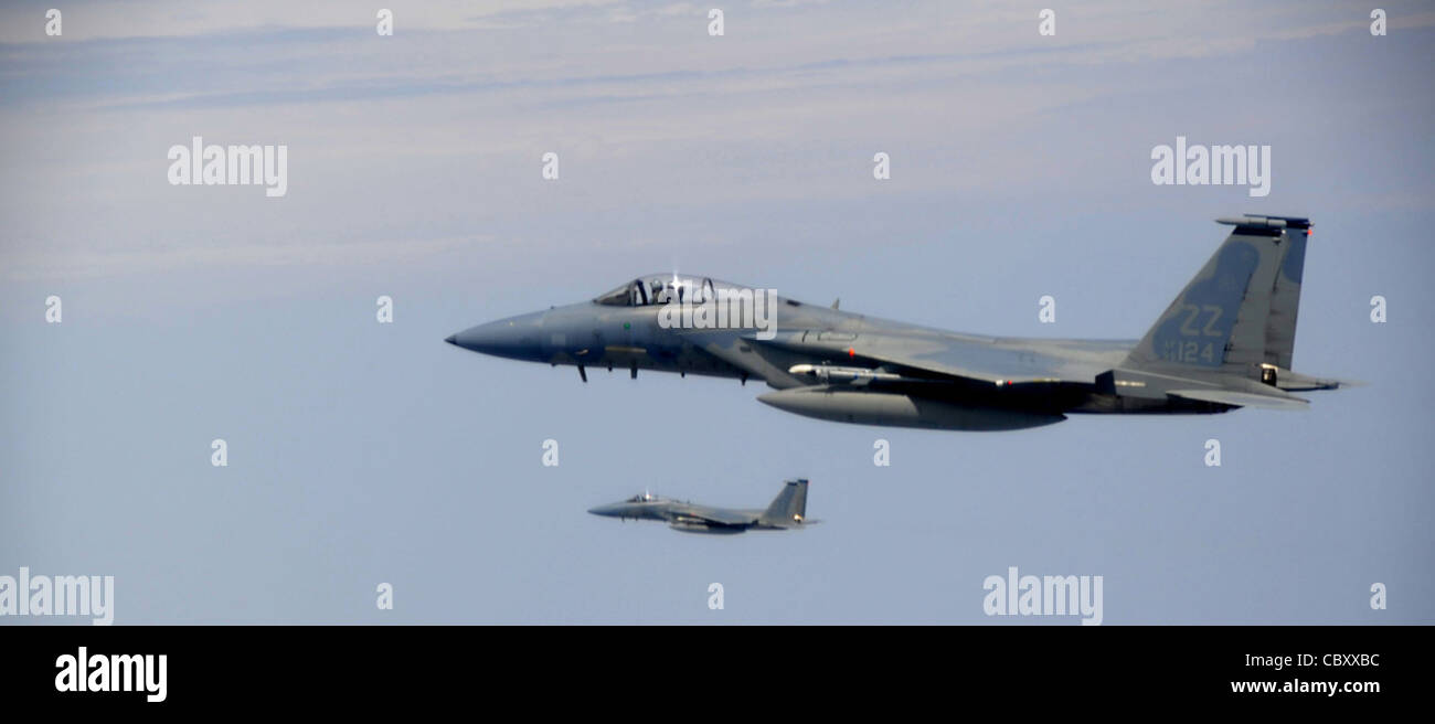 F-15 Eagles assigned to the 44th Expeditionary Fighter Squadron at Kadena Air Base, Japan, fly over Thailand March 23, 2011, prior to starting an exercise scenario during Cope Tiger 2011, which runs from March 14 through 25. Participants of Cope Tiger include the U.S. Air Force, the U.S. Marine Corps, the Royal Thai Air Force, Royal Thai Army and the Republic of Singapore Air Force. Stock Photo