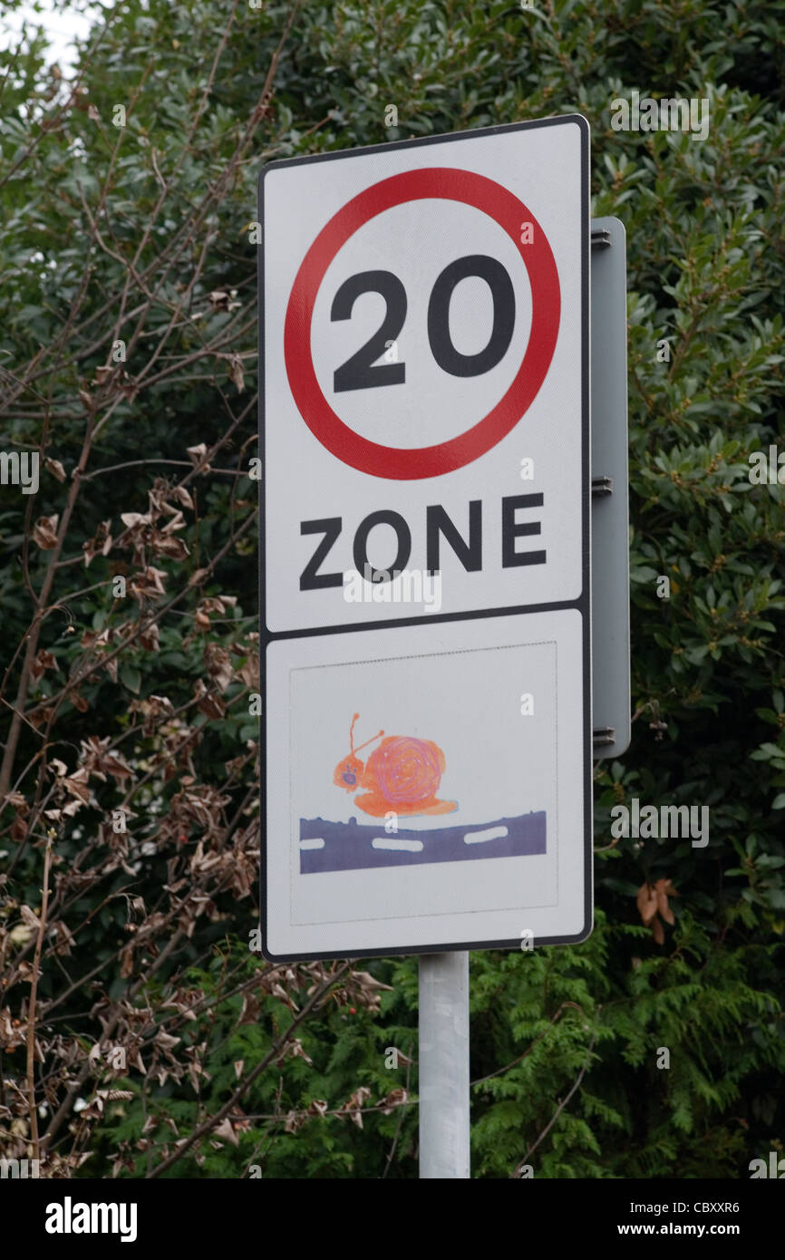 20 mph speed restriction sign with illustration by a child printed underneath Stock Photo