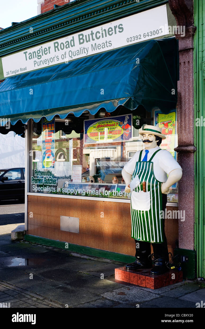 life size figure of a butcher outside of traditional butchers shop Stock Photo