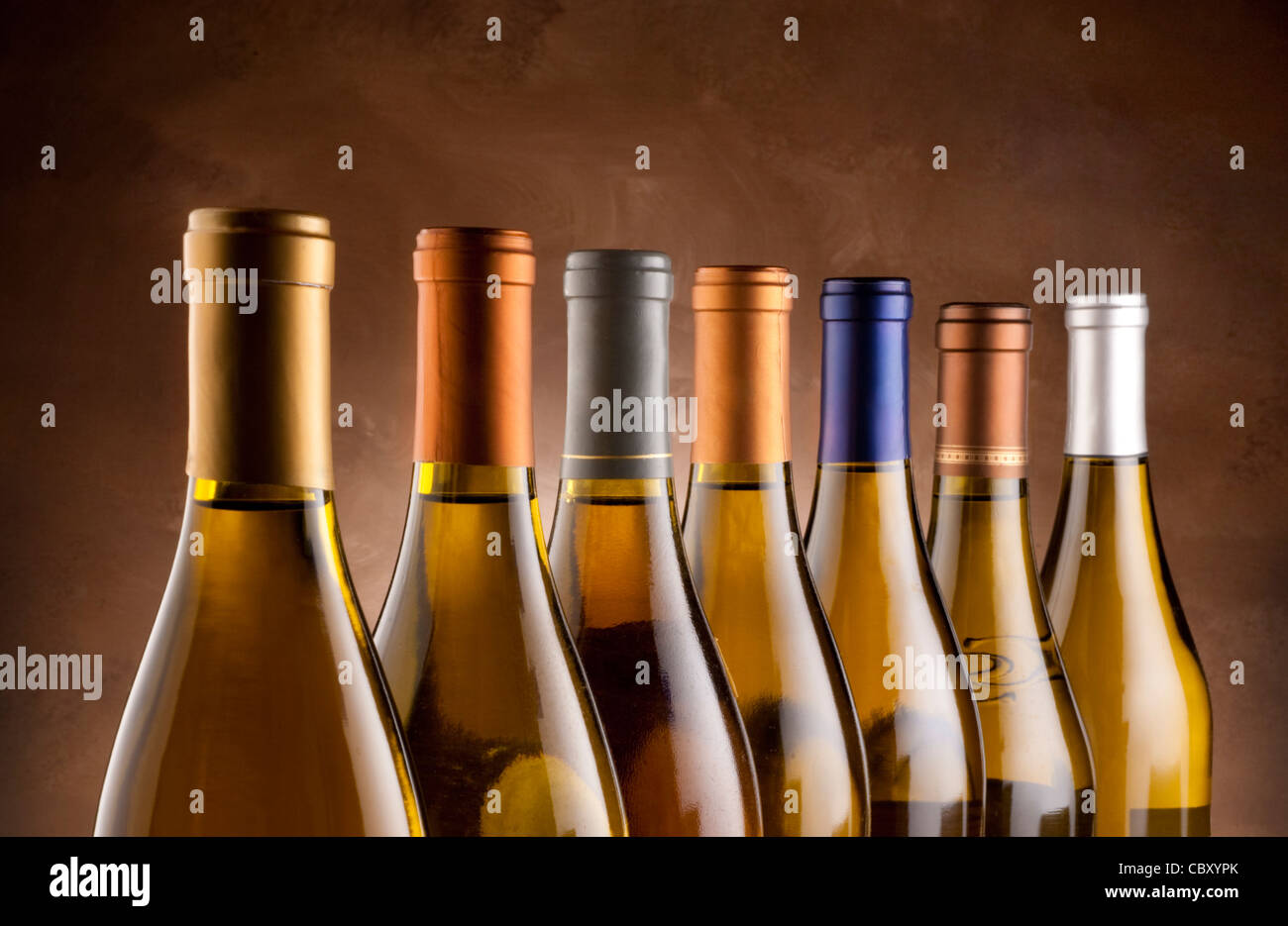 White wine bottles lined up in a row Stock Photo Alamy