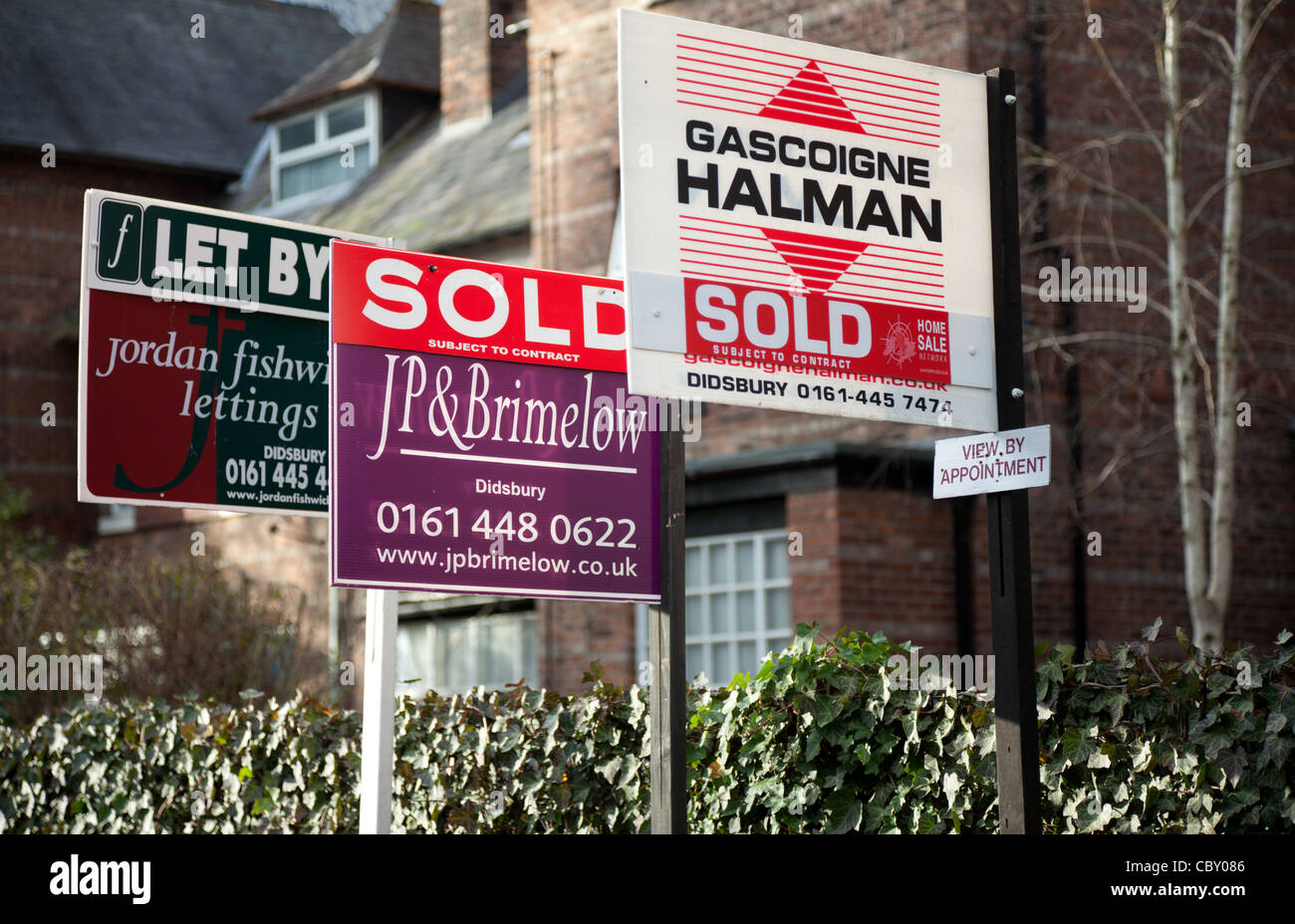 Houses and Flats in West Didsbury, Manchester showing SOLD signs. A