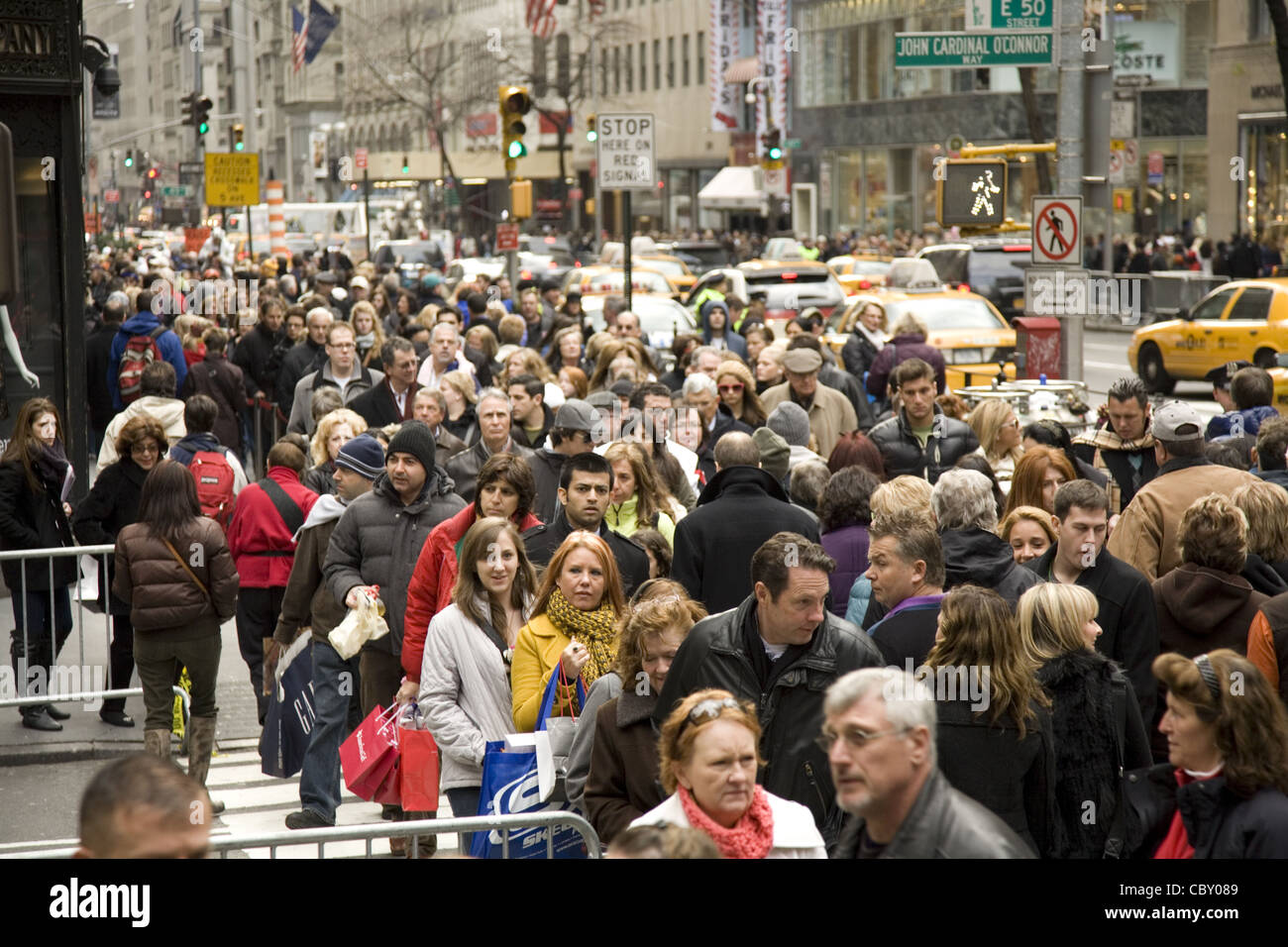 5th Ave. at 50th St. at St. Patrick's and Rockefeller Center is absolutely packed at the holiday season. Stock Photo