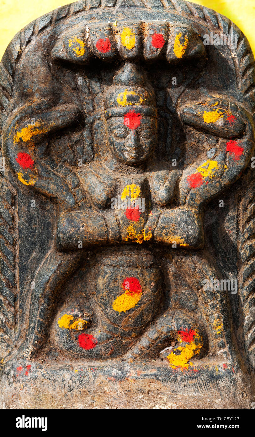 Hindu shrine stone depicting Indian vishnu deity in a south indian village, Andhra Pradesh, India Stock Photo