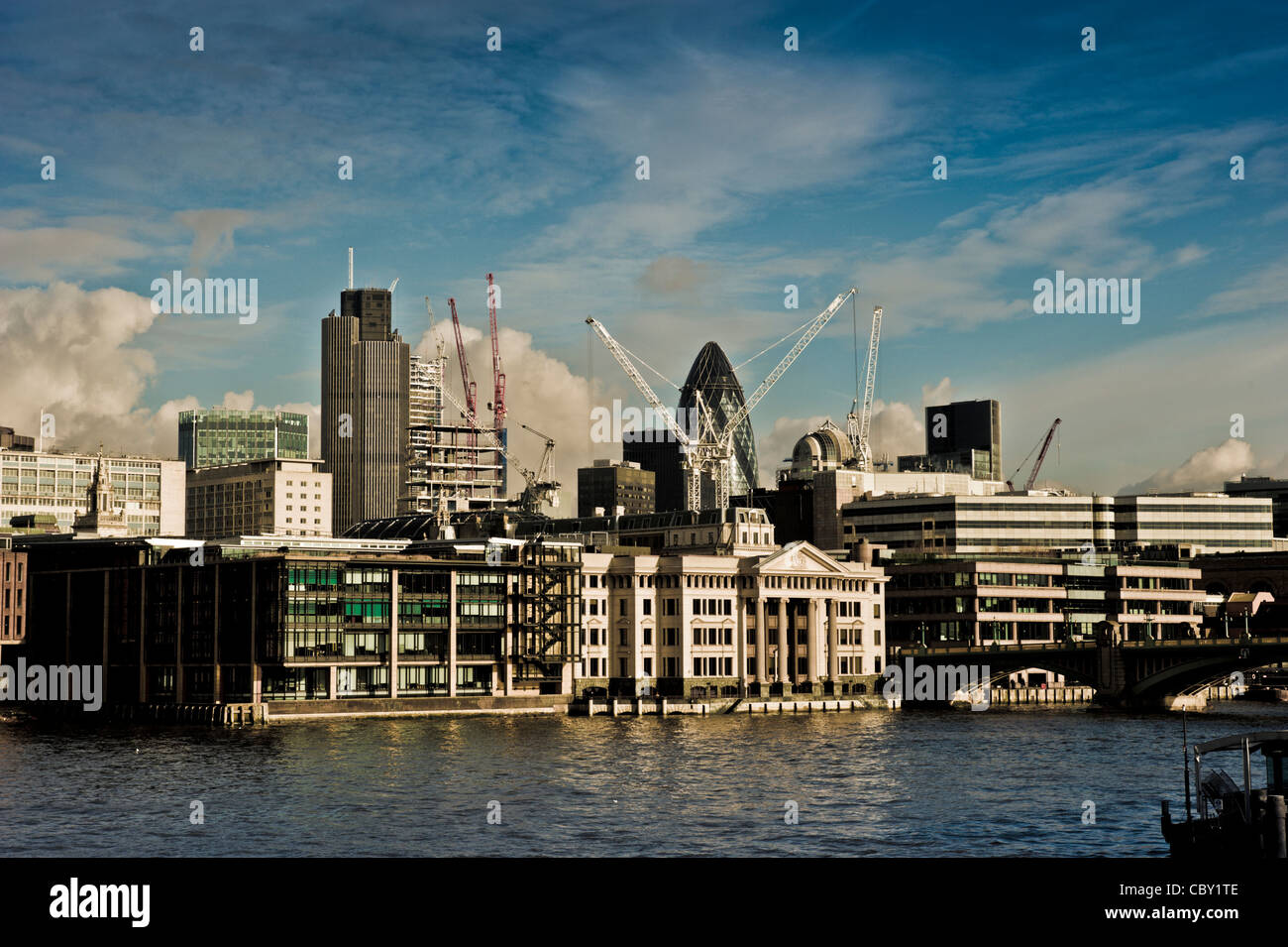 View from Tate modern towards financial district of London showing the Gherkin building and Vintners Hall. Stock Photo