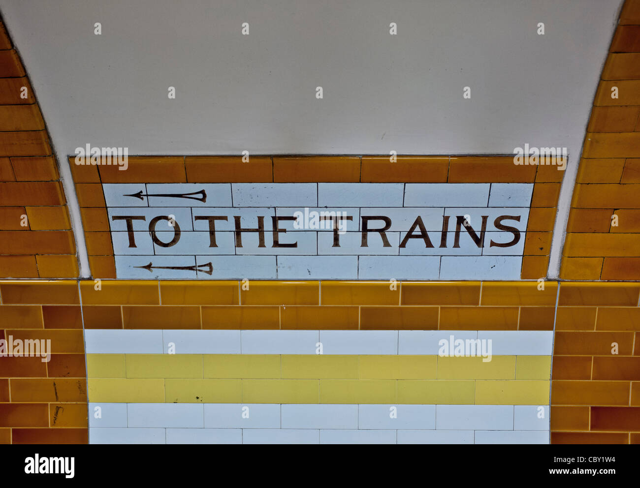 Ceramic tiled sign: To the Trains. London underground Stock Photo