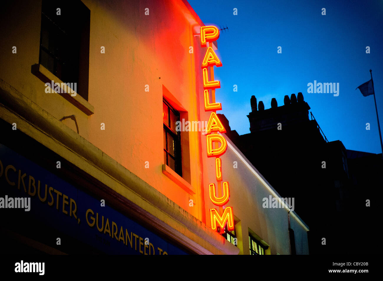 Red and yellow neon sign outside Palladium theatre, London. Stock Photo