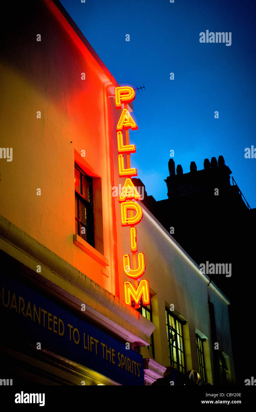 Red and yellow neon sign outside Palladium theatre, London. Stock Photo