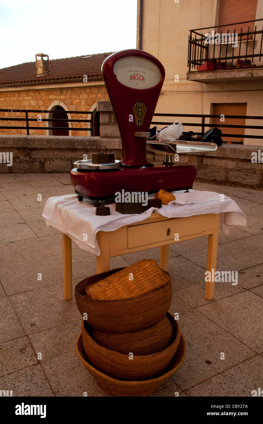 An old fashioned scale at a food fair 'Cortes Apertas' in Gavoi Sardinia Italy Stock Photo