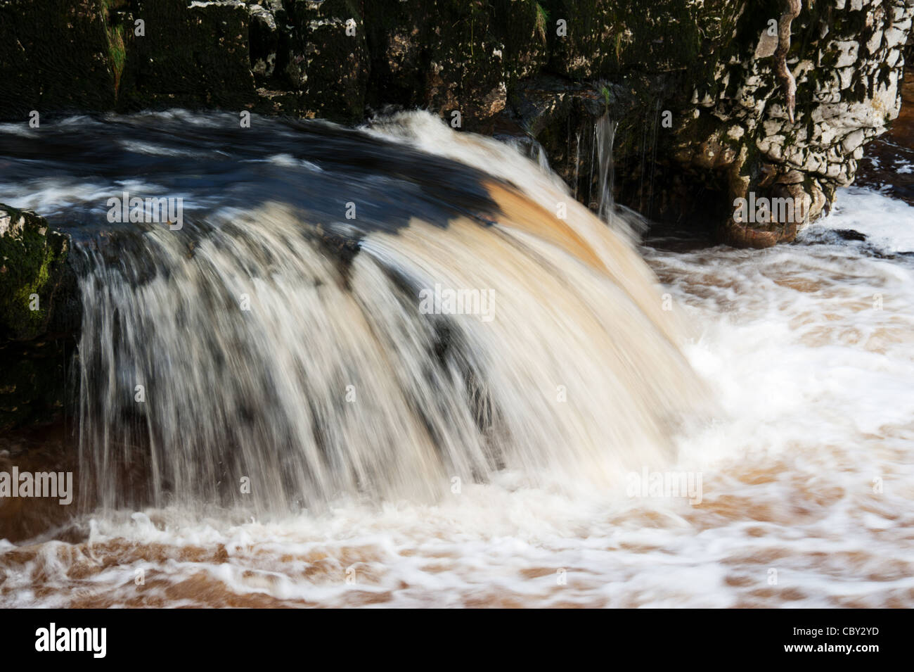Linton falls. water falls Grassinton rocks fast flowing water river river wharfe. boulders Stock Photo