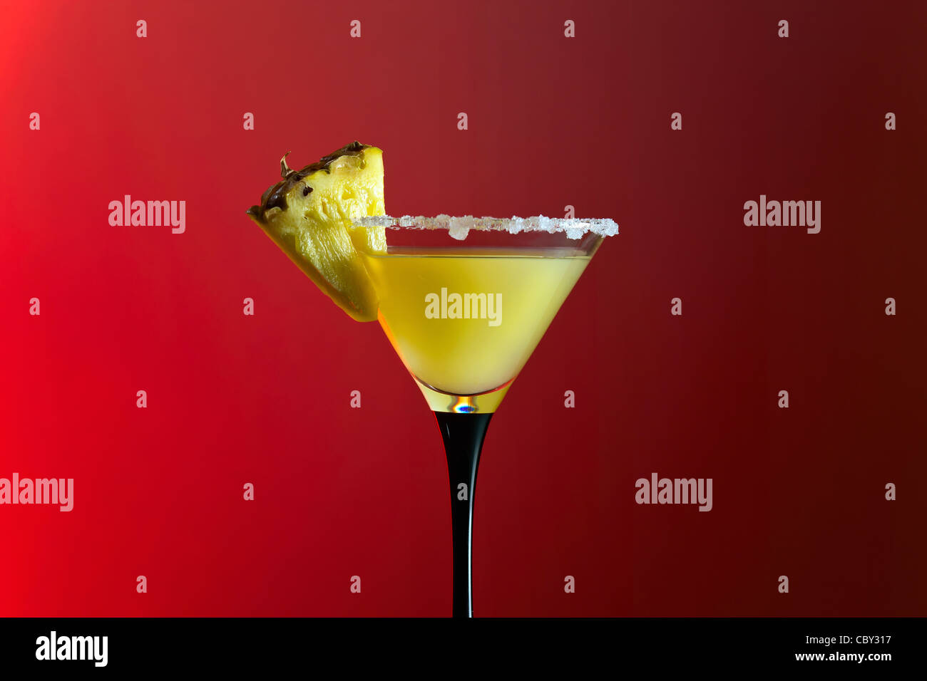 glass with cocktail on a red background. Stock Photo