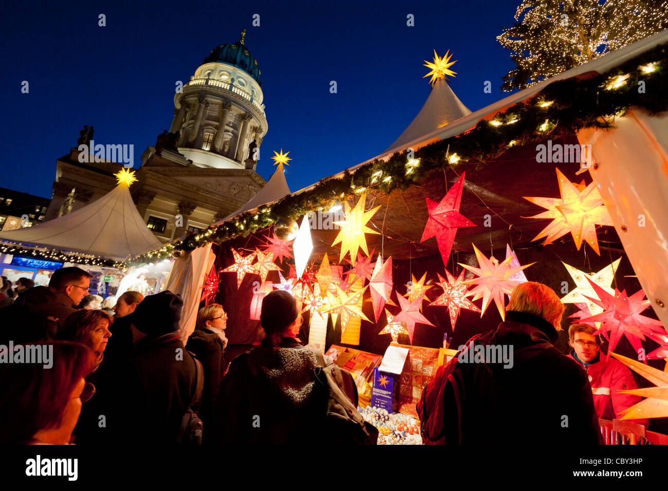 Night view of busy traditional German Christmas Market in Gendarmenmarkt in Mitte Berlin Germany Stock Photo