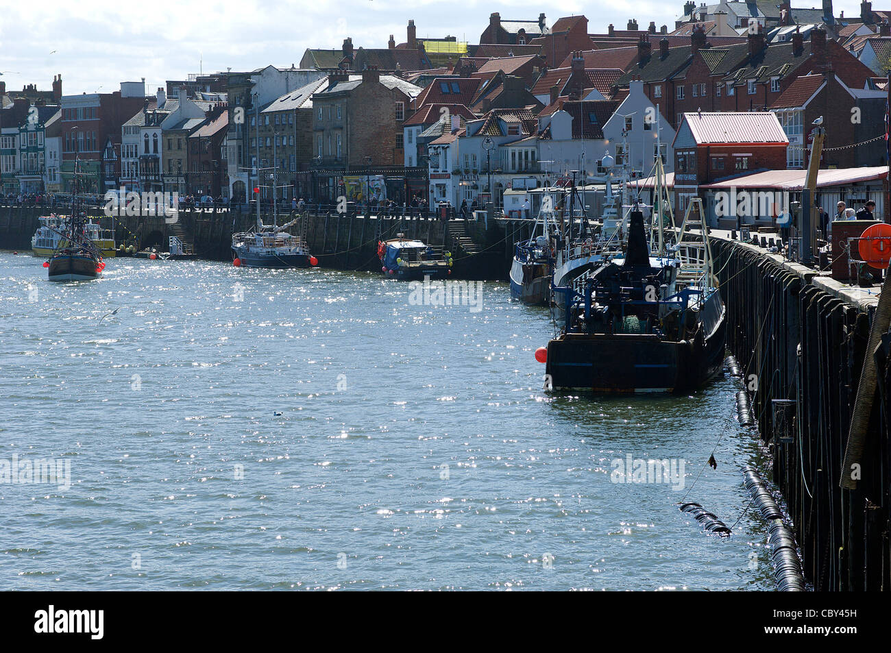 Whitby in N Yorks, England is a flourishing fishing port, Mecca for fish and chip lovers and popular tourist destination. Stock Photo