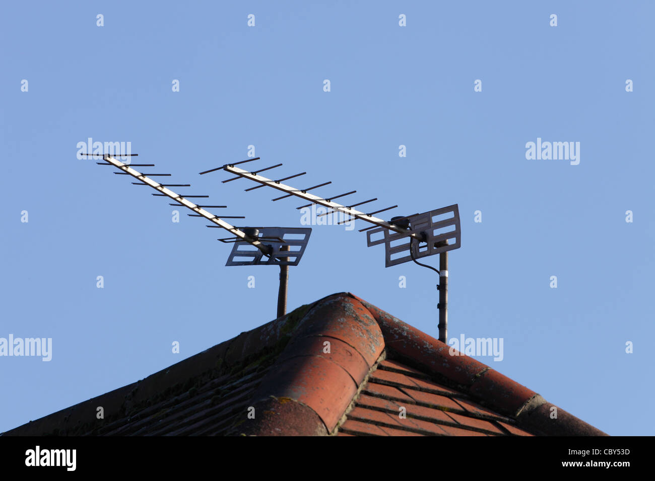 Television aerials on rooftop Stock Photo