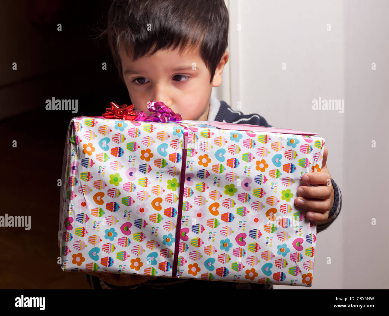 Boy holding a present Stock Photo