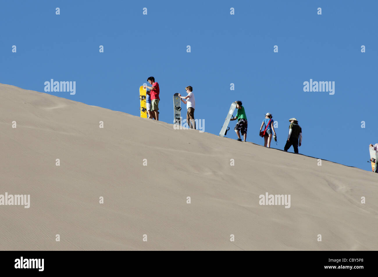 Sand dune surfing in the Atacama desert, Chile Stock Photo