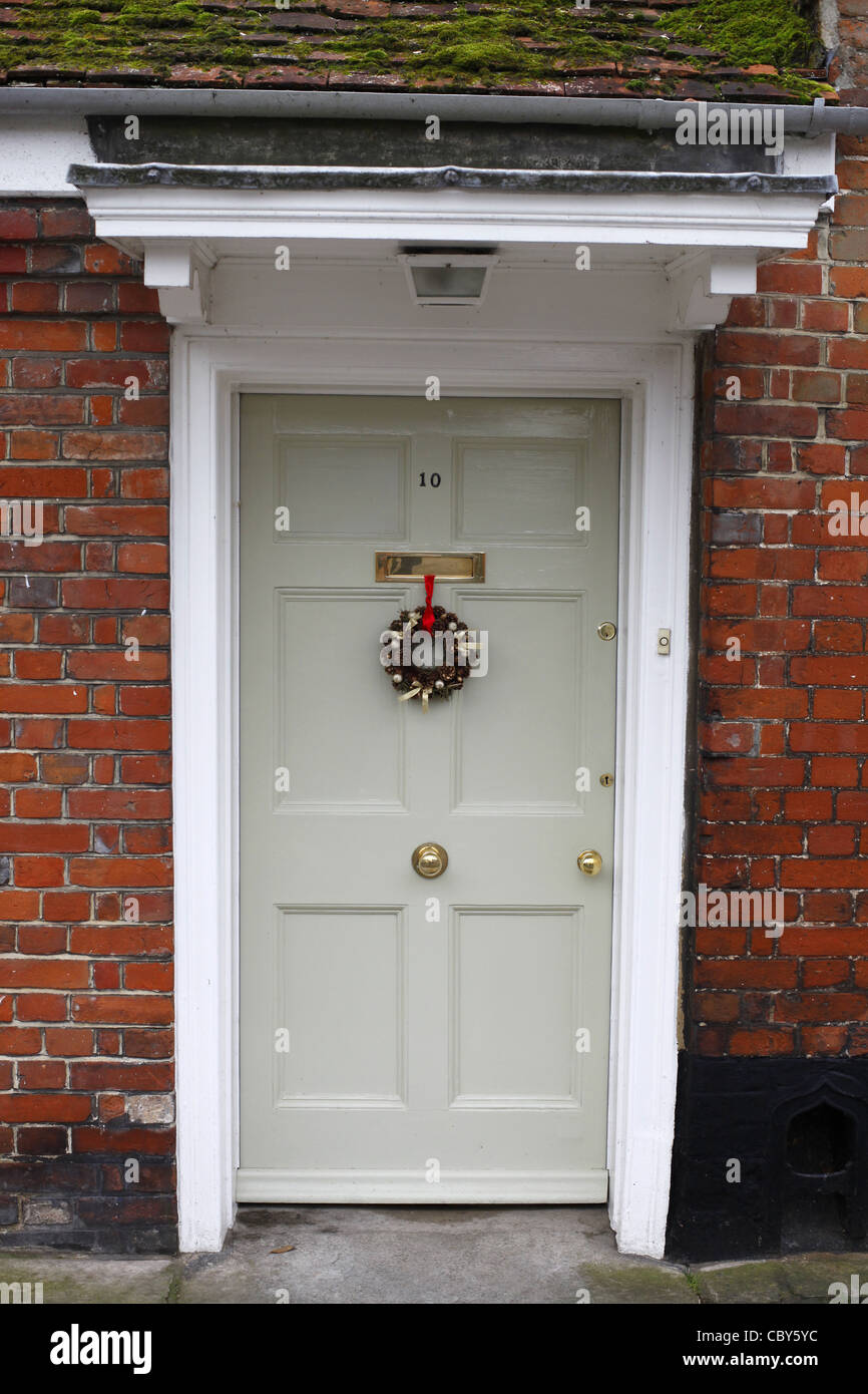 Front door with Christmas wreath. Stock Photo