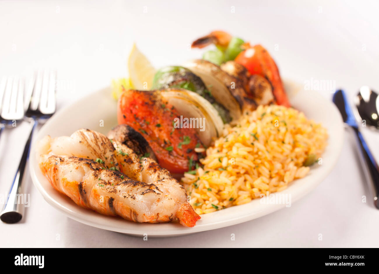 A Lobster kabob dish served wit ha side of rice, River Room Restaurant Stock Photo