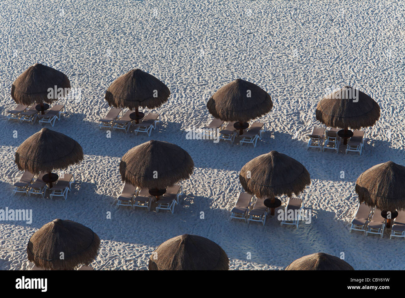 Abstract of umbrellas and lounge chairs in Cancun Mexico Stock Photo