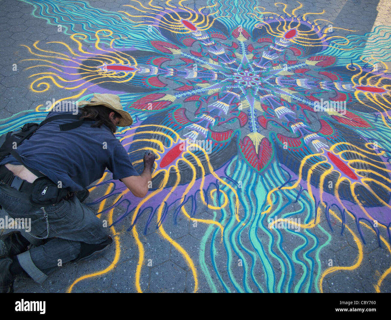 Street artist paints in chalk, Union Square, New York City Stock Photo