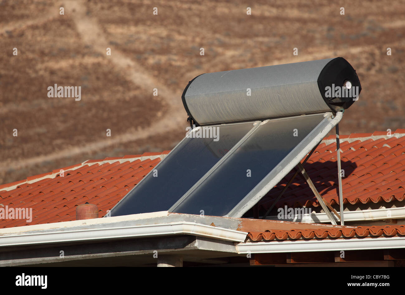 Water heating solar panels on the roof Stock Photo