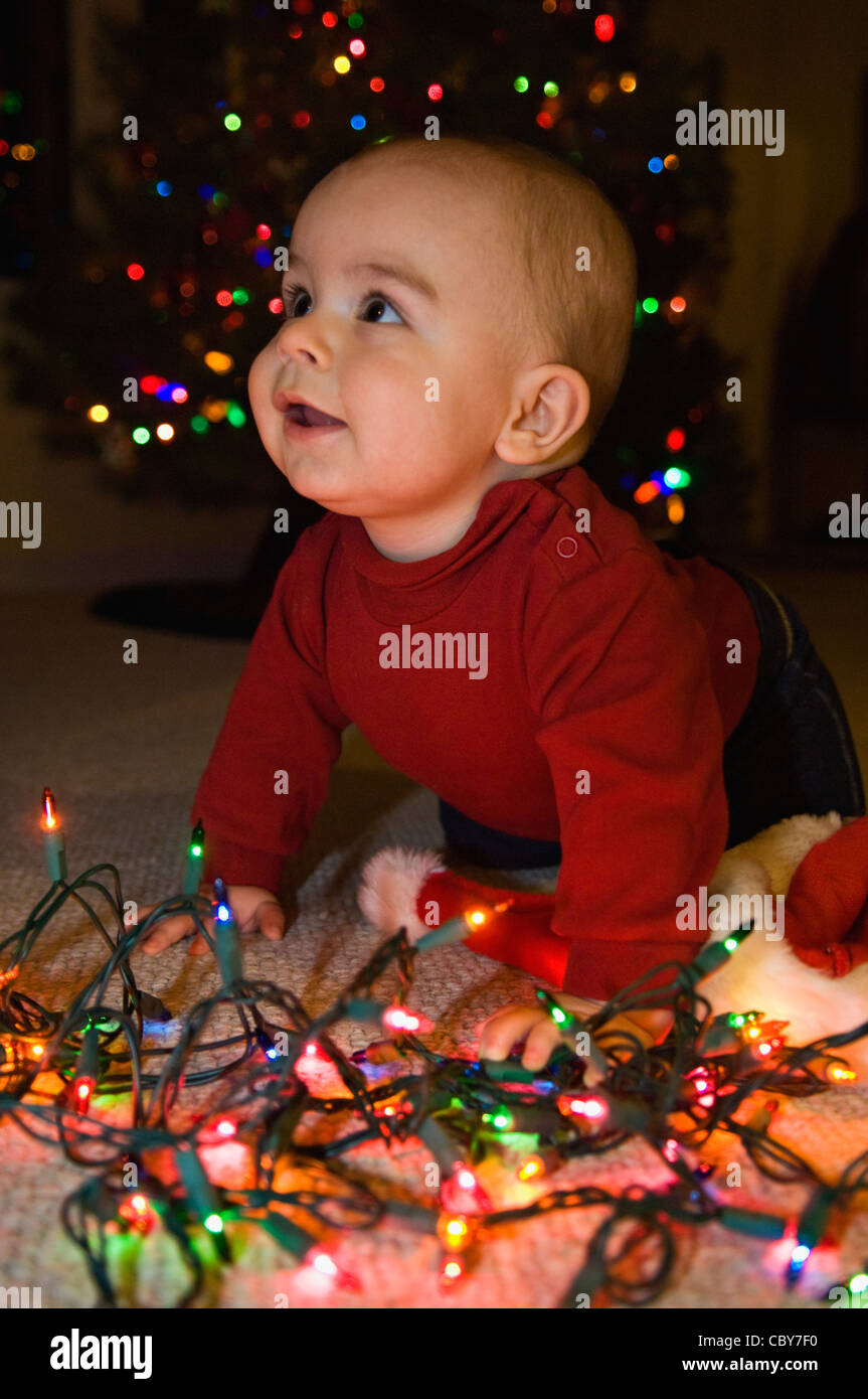 Seven Month Old Baby Boy with Christmas Lights Stock Photo