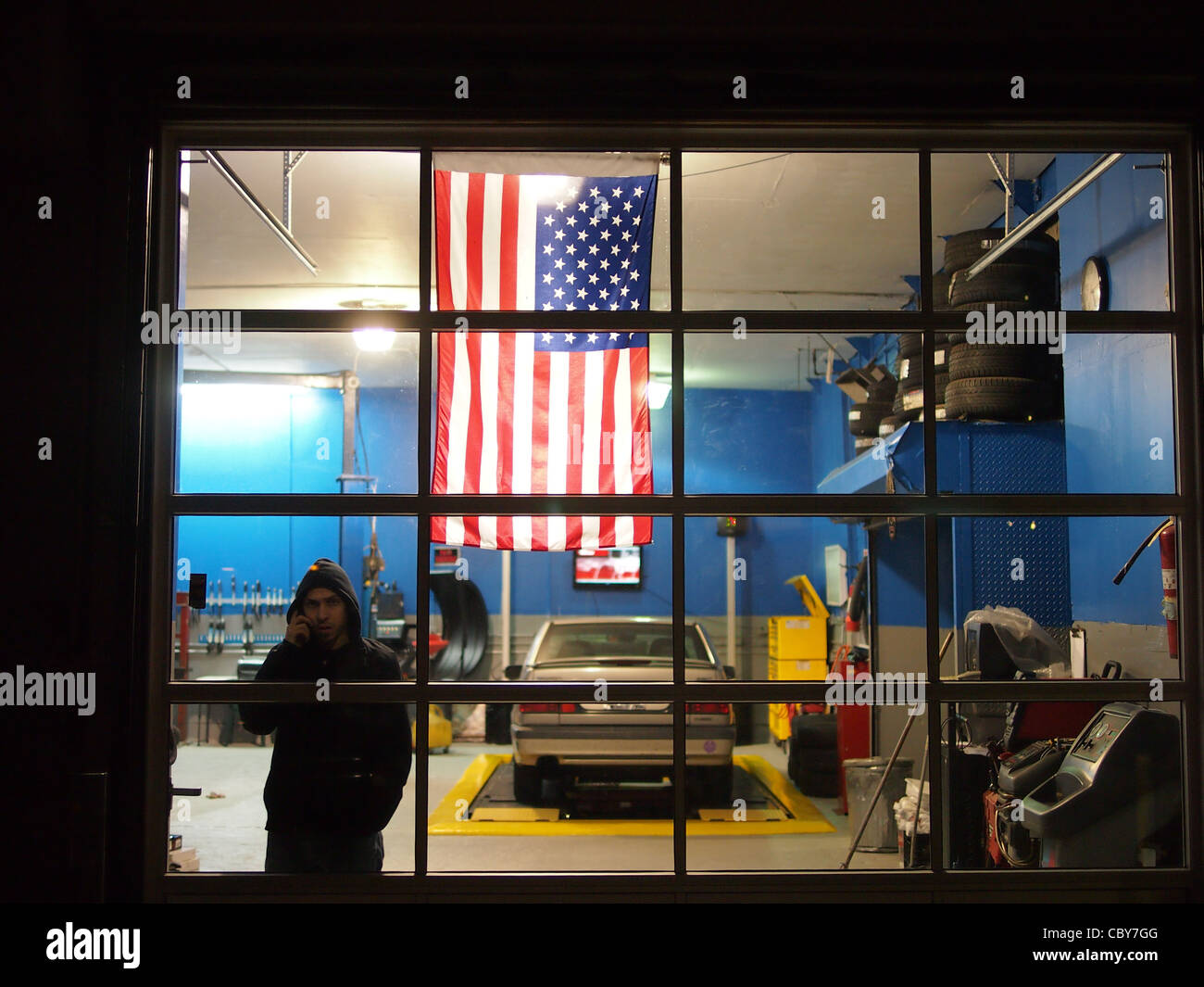 Worker in auto garage, Williamsburg, Brooklyn Stock Photo Alamy