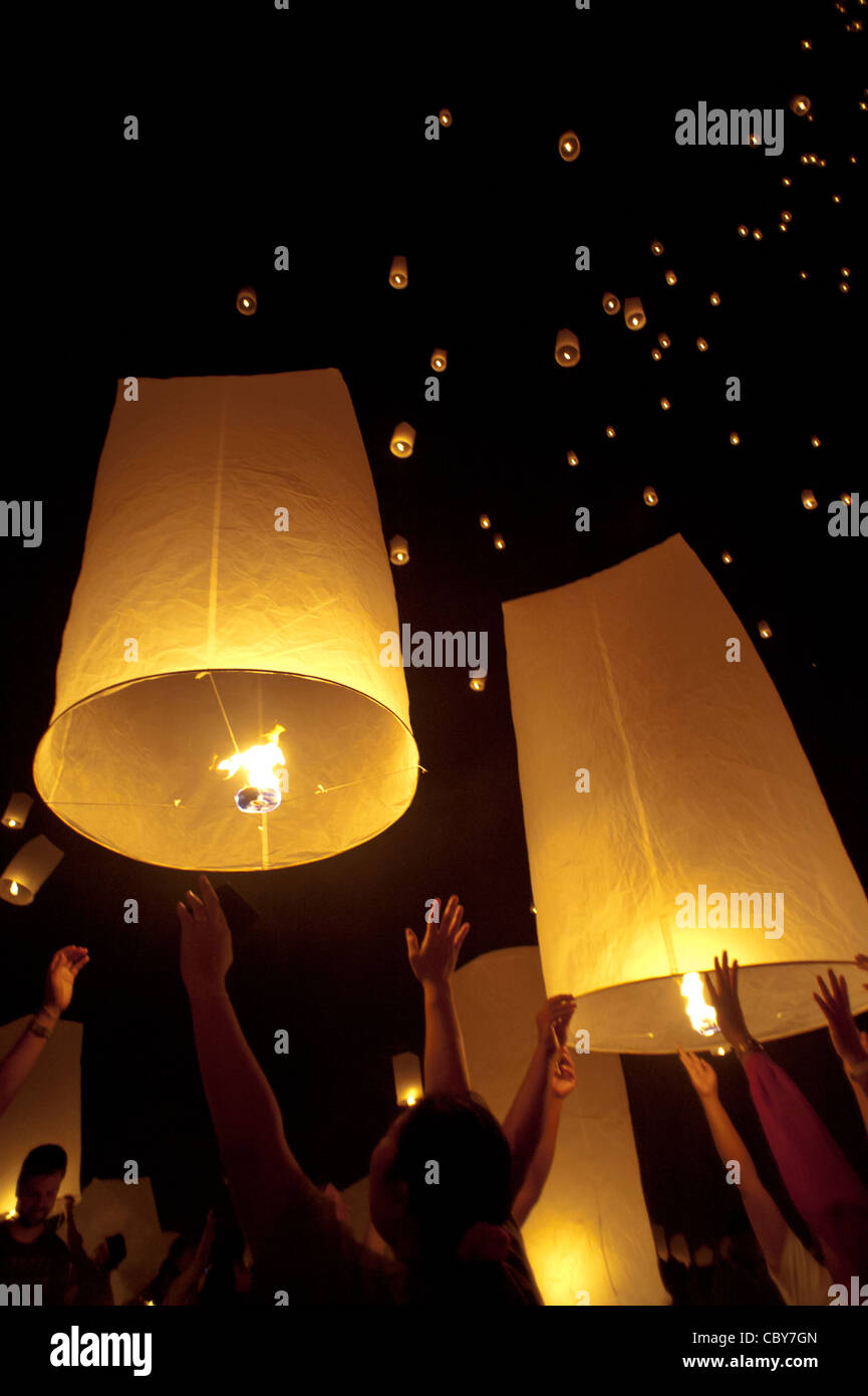 Traditional fire lanterns being released into the night sky during the Loi Krathongfestival in Chiang Mai, Thailand, Asia. Stock Photo