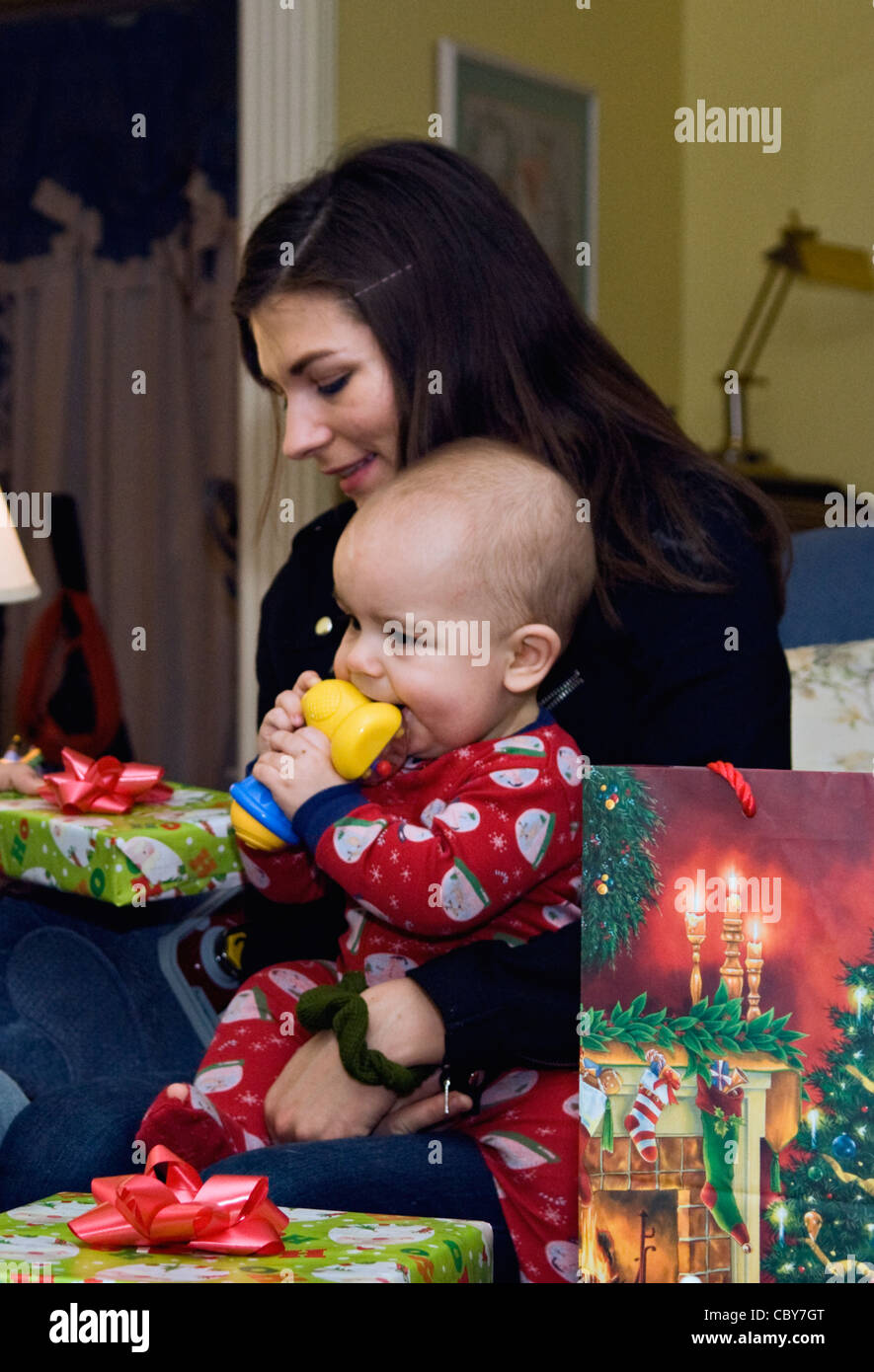 Young Mother with Baby Boy and Christmas Gifts Stock Photo