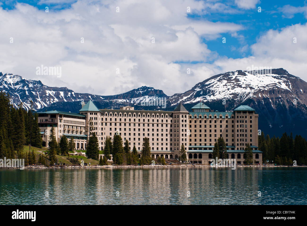 Fairmont's Chateau Lake Louise Hotel is reflected on the waters of Lake ...