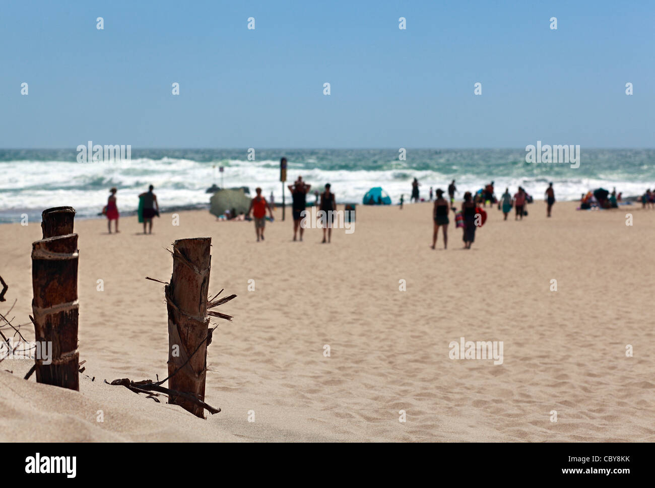 Summer holiday makers on a Durban beach during the Xmas holidays. South Africa. Foreground focus. Stock Photo