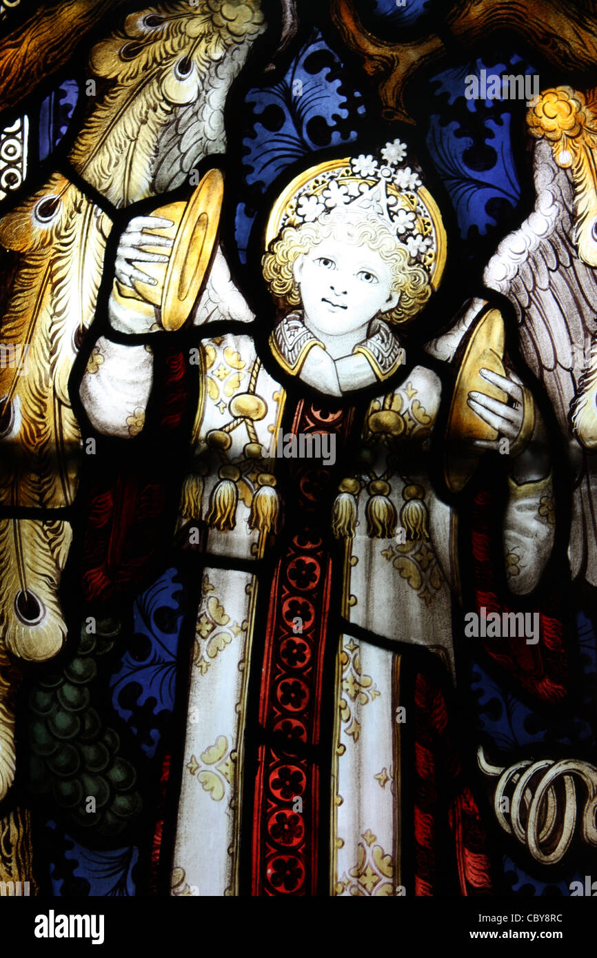 Instrumental angel in stained glass window in a chapel within Lichfield Cathedral Stock Photo