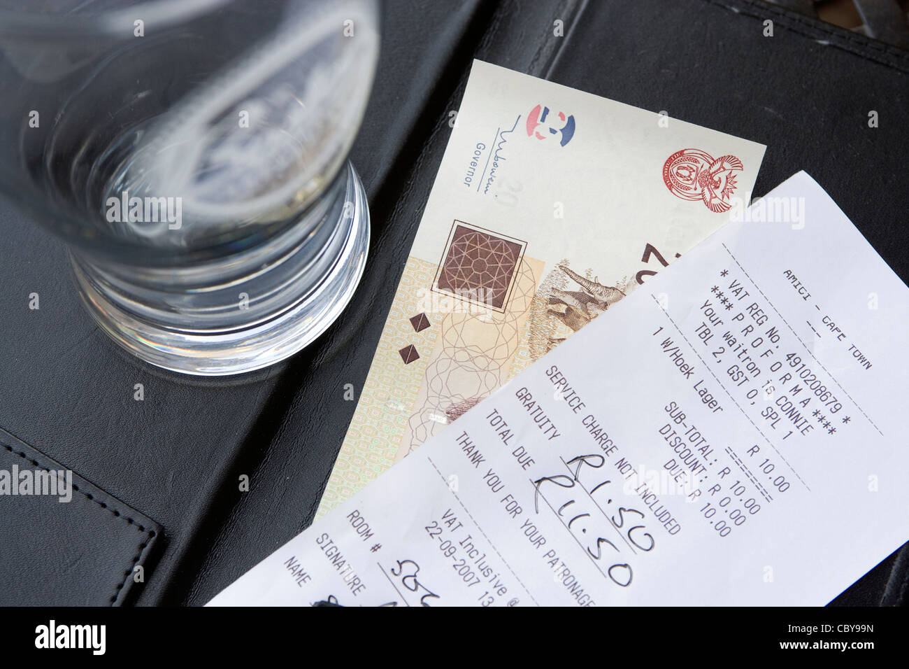 Travel bar bill receipt, currency & tip Stock Photo Alamy