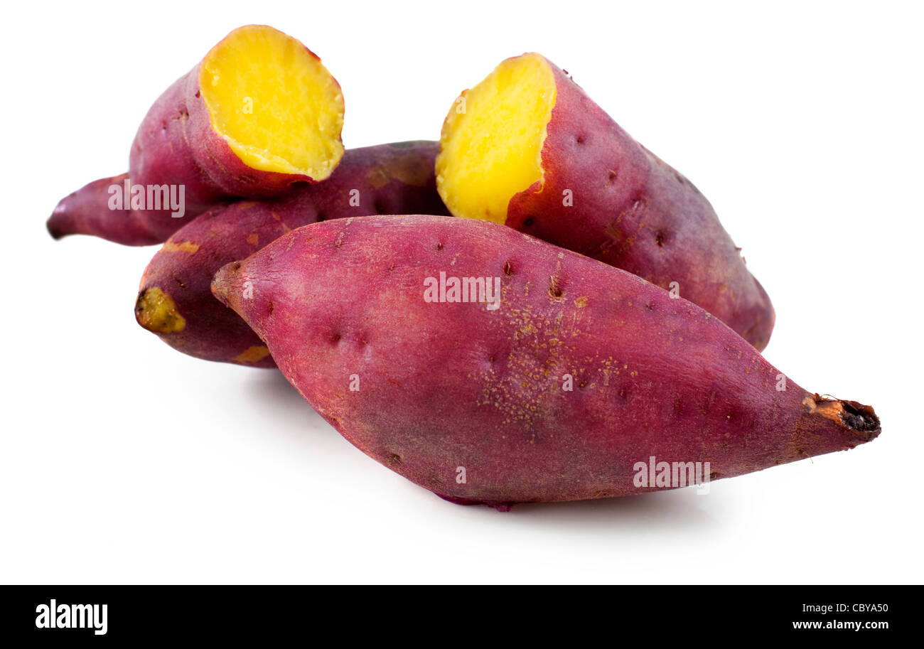 Cooked whole and halved purple sweet potatoes Stock Photo Alamy