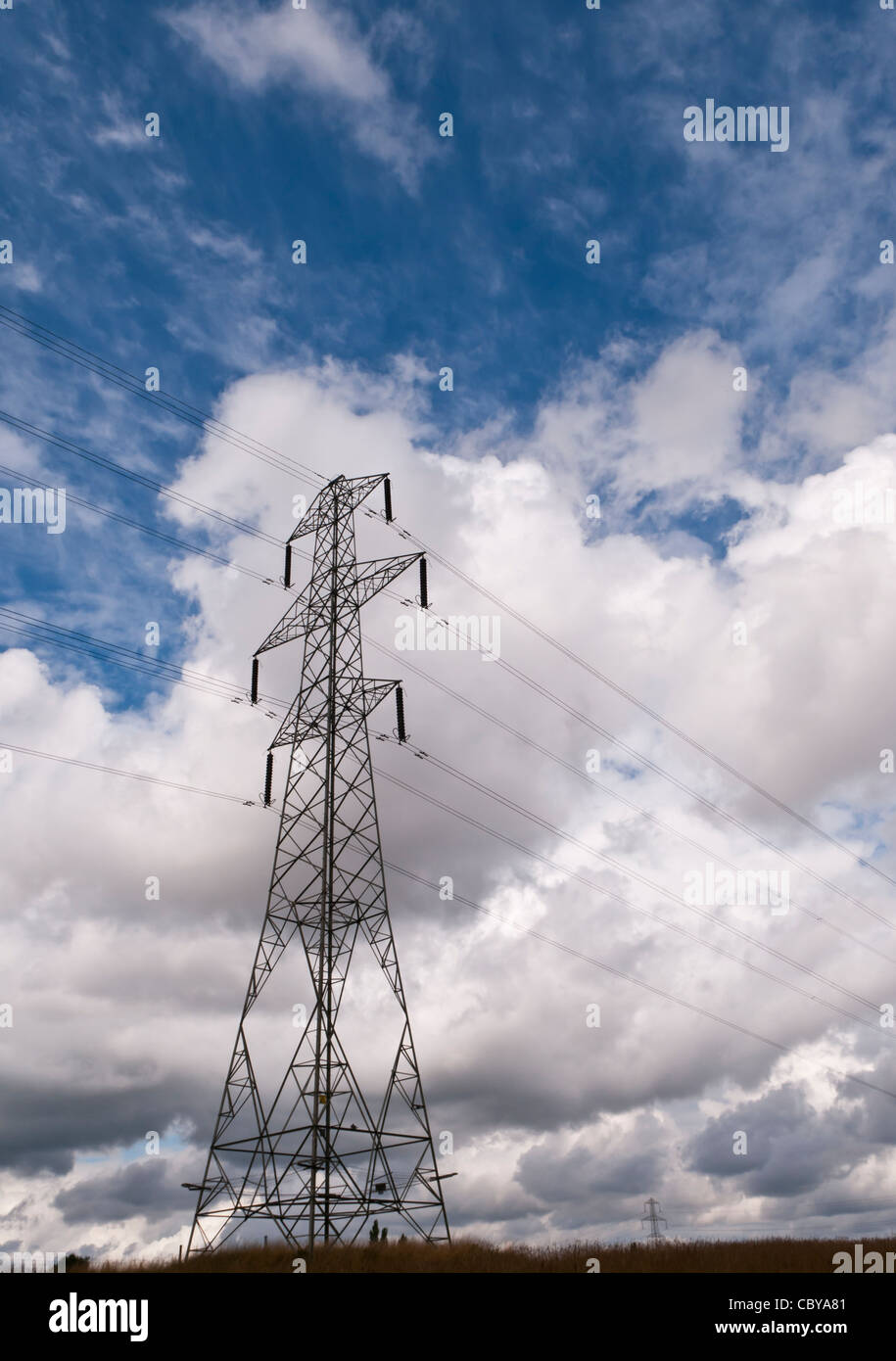 An L6 series electricity pylon against a dramatic sky in rural North Yorkshire, United Kingdom. Vertical format with copyspace. Stock Photo