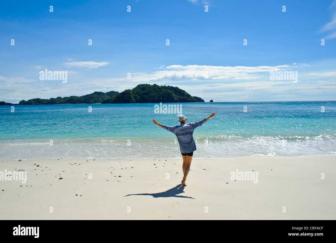 Woman enjoying the heat on a beach on the Nicoya Peninsula Costa Rica Stock Photo