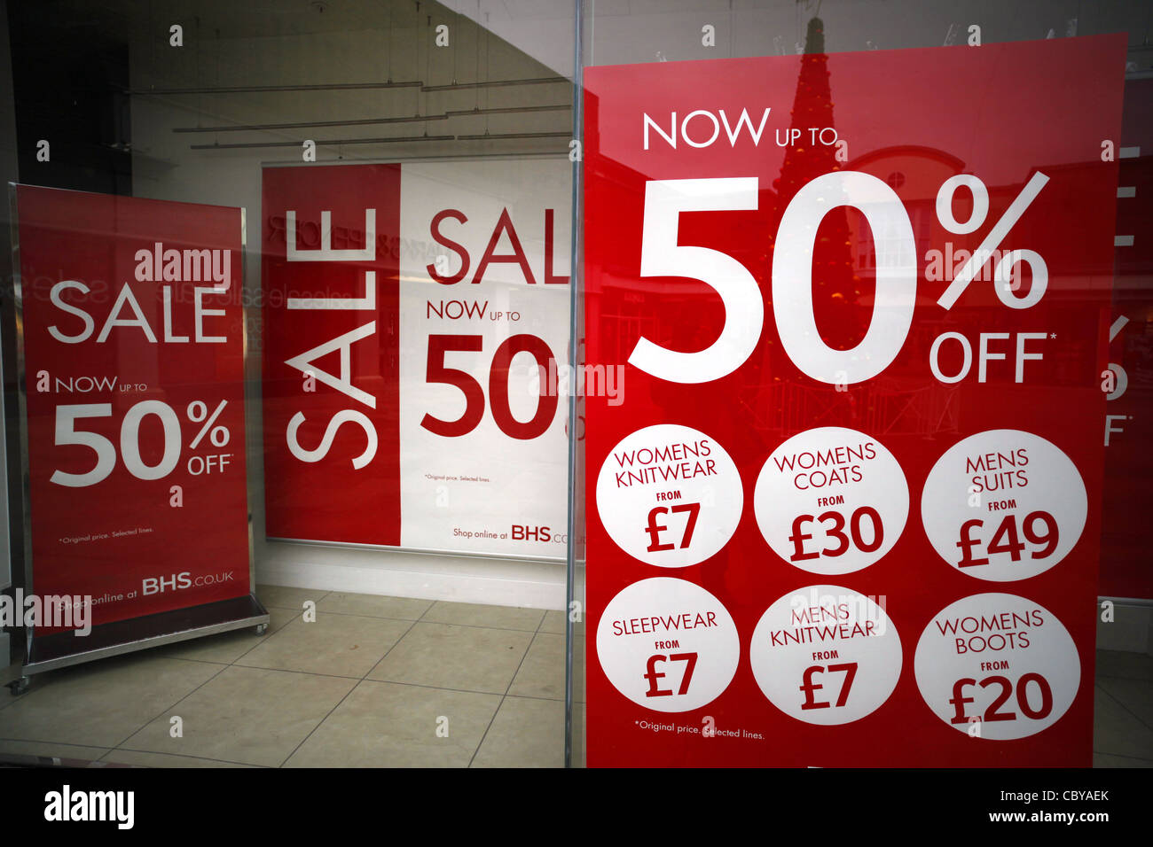 Boxing day sale posters in a BHS shop window Stock Photo