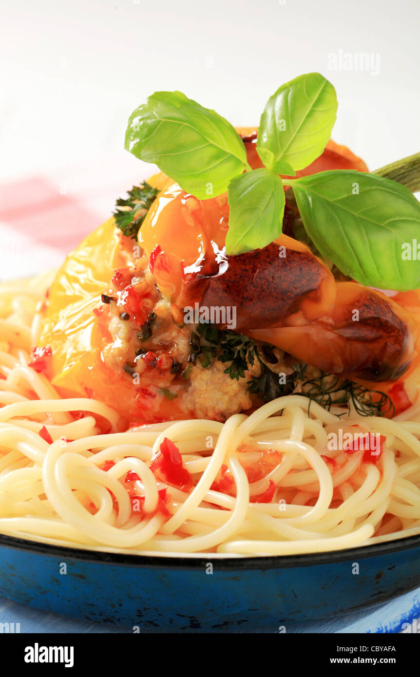 Spaghetti and yellow bell pepper stuffed with ground meat Stock Photo