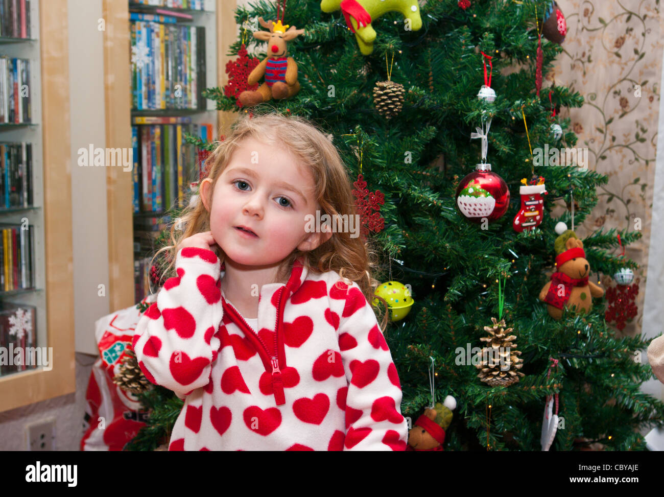 3 Year Old Child Girl Infant Toddler Standing In Front Of A Xmas Christmas Tree Stock Photo